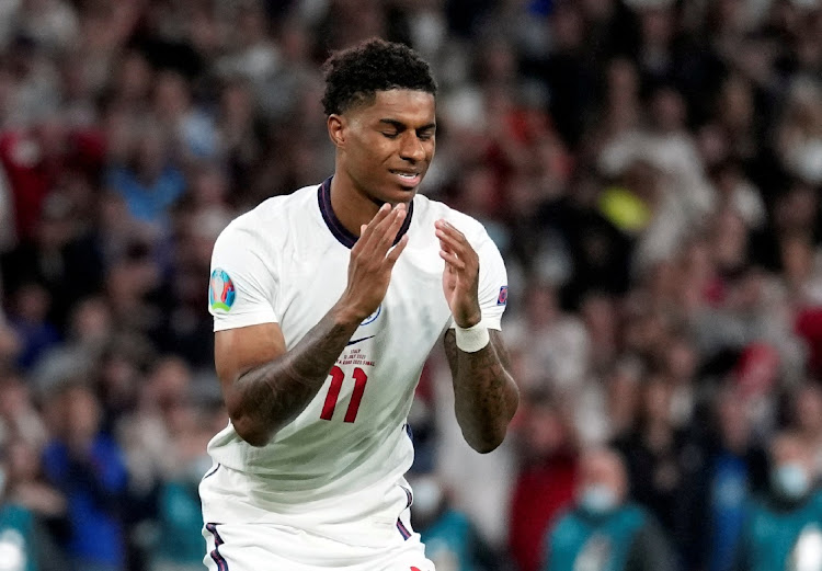 England's Marcus Rashford looks dejected after missing a penalty in the Euro 2020 final against Italy at Wembley Stadium in London on July 11, 2021