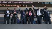 South Sudan's president Salva Kiir (with hat) holds hands with South Sudanese rebel leader Riek Machar as Sudan's president Omar al-Bashir and Kenya's president Uhuru Kenyatta witness before the signing a ceasefire and power sharing agreement in Khartoum, Sudan earlier this month.