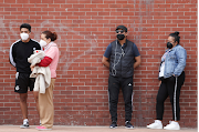 People line up to get tested at a temporary testing site for the coronavirus disease in Mexico City, Mexico on July 9 2021.
