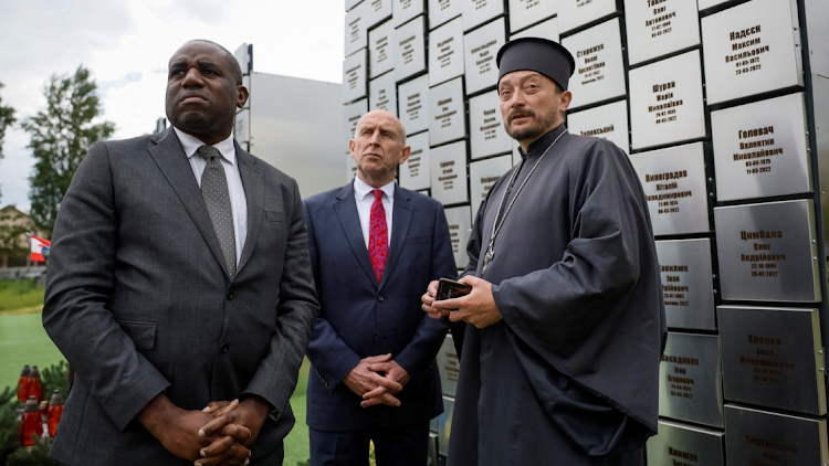 Britain's Shadow Foreign Secretary David Lammy and Shadow Defence Secretary John Healey visit a memorial installation for the victims of attacks and executions by Russian troops, in the town of Bucha, amid Russia's attack on Ukraine, outside of Kyiv, Ukraine May 13, 2024.