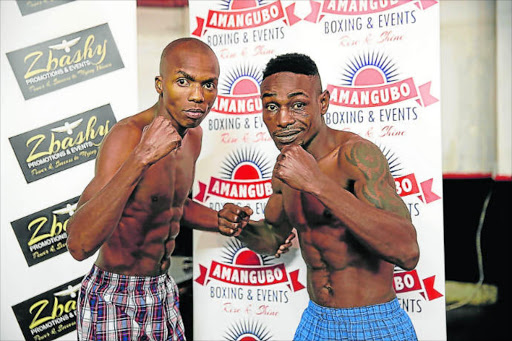 Macbute Sinyabi, left seen here with Tanzanian Francis Miyeyushu ahead of their IBO International featherweight title clash, will take on Azinga Fuzile at Orient Theatre next month.