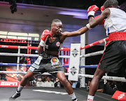 Simangele Hadebe, left, jabs at Tanzanian Stumai Muki on her way to a stoppage victory.