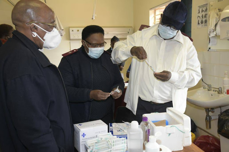 Home affairs minister Aaron Motsoaledi monitors Covid-19 vaccinations at the Thabaleshoba community health centre in the Waterberg district in June 2021.