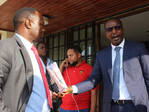 KRA lawyer David Mitweka and Darasa Investment's Dennis Mosota outside Mombasa law court, January 9, 2018. /MALEMBA MKONGO