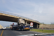 Trucks near the Mooi River toll plaza were torched as the July riots started. File photo.