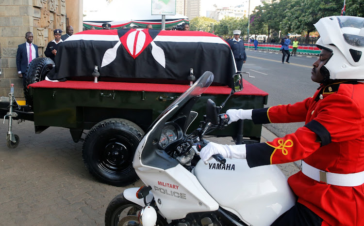 A military officer escorts the coffin of late former Kenya's President Daniel Arap Moi./REUTERS