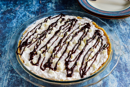 Chocolate sauce and white chips on top of the White Chocolate Pie.