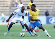 Sibusiso Vilakazi of Mamelodi Sundowns is challenged by Sifiso Hlanti of Bidvest Wits during the Absa Premiership match at Lucas Moripe Stadium in Atteridgeville, west of Pretoria, on October 7, 2018.