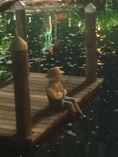 Boy in Koi Pond fishing