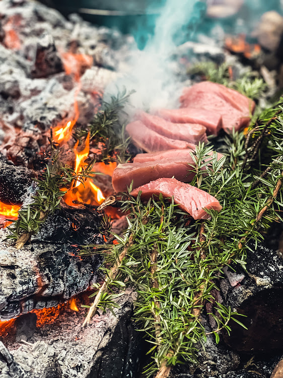 Tuna smoked over fire.