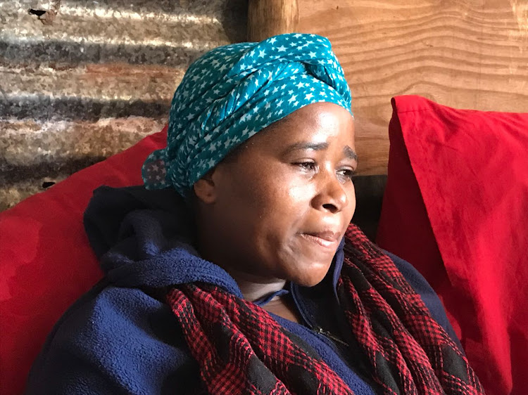 Phumzile Mkhize weeps at her home in eKukhayeni in the wake of the murder of her husband, S’fiso Ngcobo.