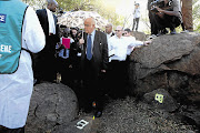 A crime scene investigator explained to retired Judge Ian Farlam, the chairman of the commission of inquiry into the Marikana massacre, where the bodies were retrieved after the shooting.