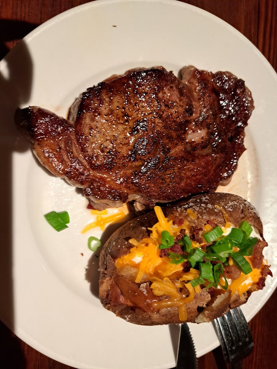 Ribeye with loaded baked potato