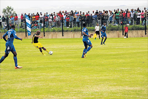 ------ Mthatha Bucks leading goal scorer Mazwi "Jomo" Mncube has a crack at goal against Magesi FC in their NFD game at the Mthatha Stadium Picture: MKHULULI NDAMASE