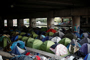 General view of abandoned tents and belongings are seen near the canal as police evacuate hundreds of migrants living in makeshift camps in Paris, France, May 30, 2018. 