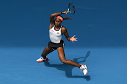 Coco Gauff of the US plays a forehand in her round one singles match against Katerina Siniakova of the Czech Republic on day one of the 2023 Australian Open at Melbourne Park on January 16 2023.