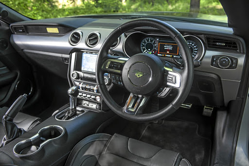 A plaque on the passenger side of the Mustang RTR Spitfire's interior is made from an actual piece of the veteran plane it's been inspired by.