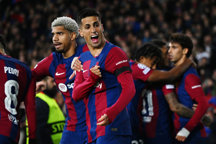 Joao Cancelo of FC Barcelona celebrates after teammate Joao Felix scores the team's second goal in the Uefa Champions League match against FC Porto at Estadi Olimpic Lluis Companys in Barcelona, Spain on Tuesday night.