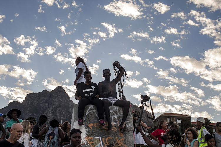 The removal of the statue of British colonialist Cecil John Rhodes from the University of Cape Town in 2015 set off the Fallist student protest movements. Picture: CHARLIE SHOEMAKER/GETTY IMAGES