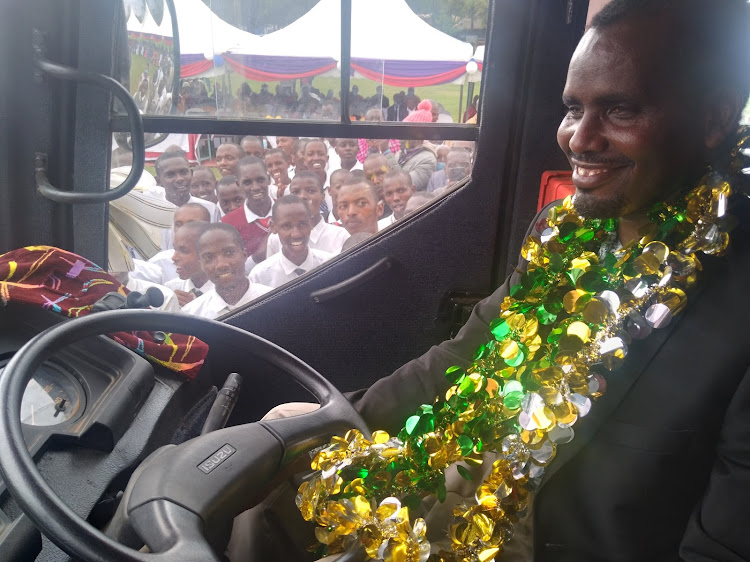 Narok South MP Korei ole Lemein tests a 62-seater bus belonging Ololulung’a Boys High School that was funded by the area National Government Fund to tune of Sh12 million at the school on Friday.