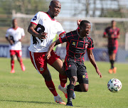 Lindokuhle Mbatha of TS Galaxy challenged by Alfred Ndengane of Tshakhuma Tsha Madzivhandila.