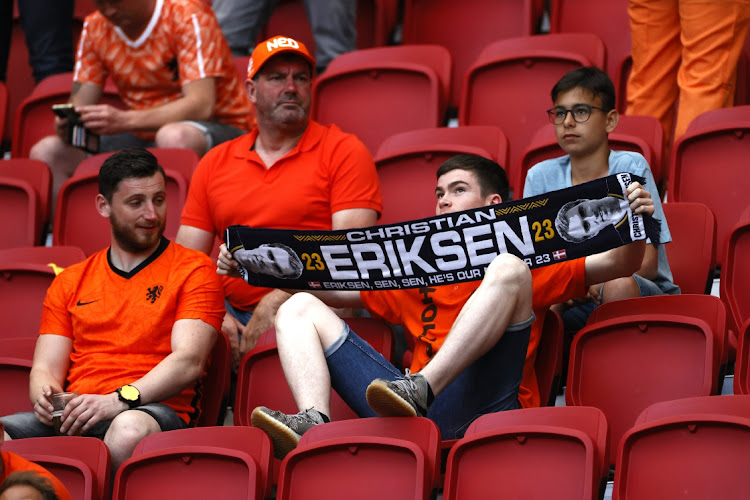 A Netherlands fan holds up a Christian Eriksen (Not pictured) of Denmark scarf in support prior to the UEFA Euro 2020 Championship Group C match between Netherlands and Ukraine at the Johan Cruijff ArenA on June 13, 2021 in Amsterdam, Netherlands.