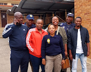 Johannesburg metro police officers and Jacob Moila's family outside the Orlando magistrate's court where a drunk driver who killed a metro cop was sentenced to 10 years in prison.