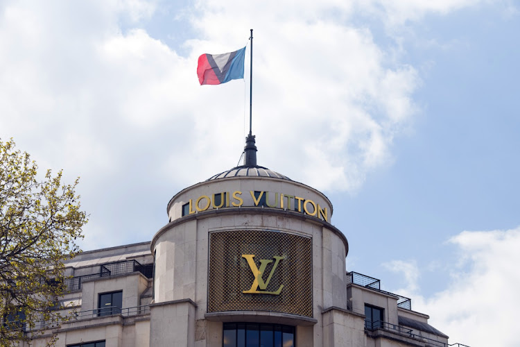 A logo on the Louis Vuitton luxury goods store, operated by LVMH Moet Hennessy Louis Vuitton SE, on the Champs Elysee in Paris, France, on Wednesday, April 14, 2021.