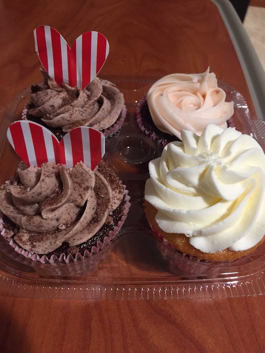 Oreo cupcakes, vanilla and chocolate with strawberry frosting.