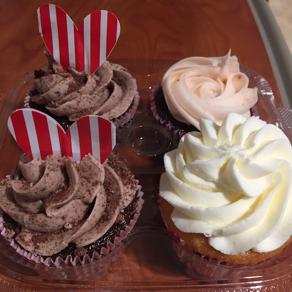 Oreo cupcakes, vanilla and chocolate with strawberry frosting.