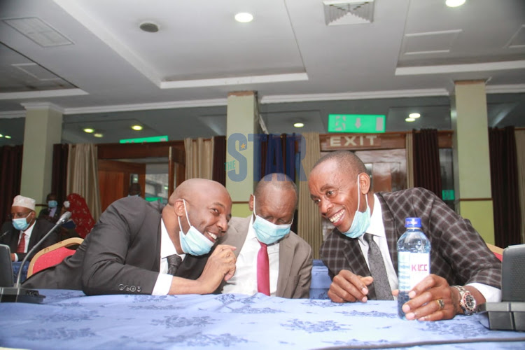 Murang'a Senator Irungu Kang'ata chats with his Kiambu counterpart Kimani Wamatang'i at the KICC ahead of a Jubilee PG meeting on February 9, 2021.