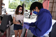 An employee scans the phone of a person visiting Six Flags Magic Mountain amusement park on the first day of opening. Similar technology will be deployed in Singapore to check if travellers have been vaccinated for Covid-19.