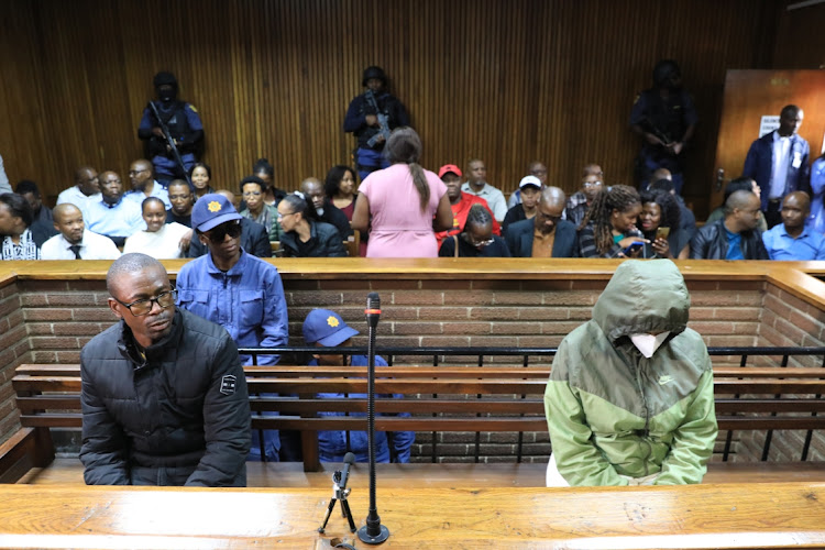 Teboho James Dipholo appears in the Bloemfontein magistrate's court with Dr Nandipha Magudumana (in a green jacket) on April 13.