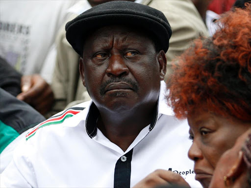 Cord leader Raila Odinga seated on tarmac along University Way during anti-IEBC protests, May 11, 2016. Photo/JACK OWUOR