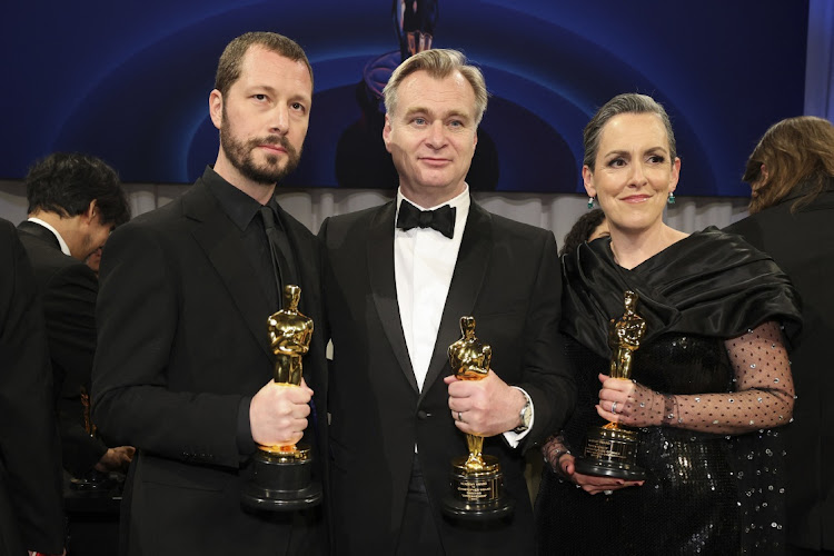 Christopher Nolan and Emma Thomas, winner of the Oscar for Best Picture for "Oppenheimer", pose with Mstyslav Chernov, winner of Oscar for Best Documentary Feature Film for "20 Days in Mariupol" at the Governors Ball following the Oscars show at the 96th Academy Awards in Hollywood, Los Angeles, California, US, March 10, 2024.