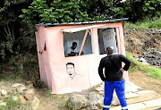 A barber gives a haircut in his barbershop in Umlazi, KwaZulu-Natal, during the lockdown. He says the income helps him to buy necessities. 