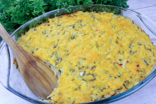 Chicken and wild rice casserole with a spoonful taken out.