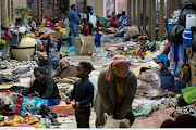 Hundreds of refugees are encamped outside the UNHCR demanding to be resettled outside SA because they do not feel safe in the country.