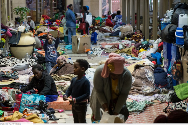 Hundreds of refugees are encamped outside the UNHCR demanding to be resettled outside SA because they do not feel safe in the country.