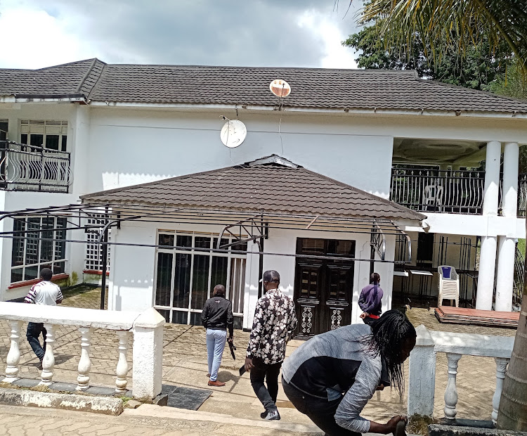 An armed police officer keeping vigil outside former Kakamega senator Cleophas Malala's house in Milimani estate on Thursday, September 1.