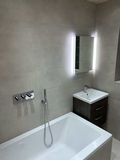 Complete bathroom upgrade.   Matte porcelain wall and floor tiles. 3 way bath, filler, fixed shower head and hand held concealed shower valve. LED lighting.