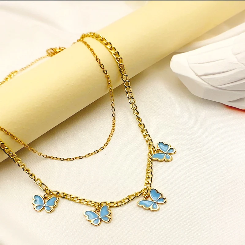 Meisjesketting met dubbellaagse vlinderhanger met druppelolie, een schattige accessoire voor een elegante uitstraling.