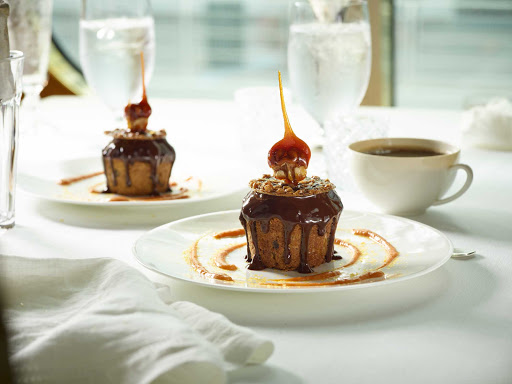 HAL-Main-Dining-Room-Jacque-Torres-Pumpkin-Chocolate-Cake.jpg - A pumpkin chocolate cake, designed by master pastry chef Jacques Torres, served in the main dining room of your Holland America cruise. 