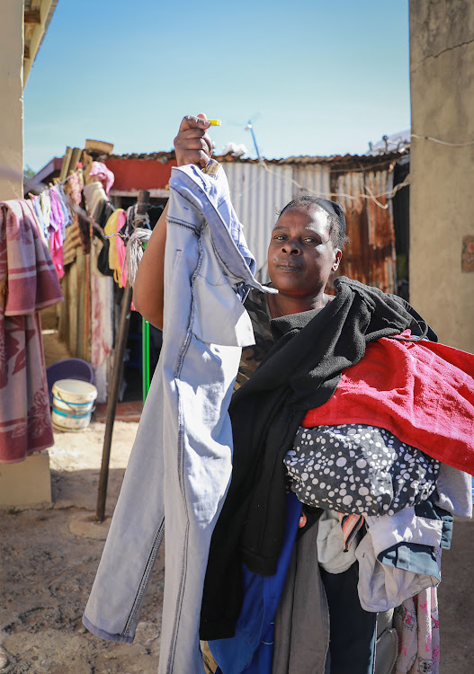 Priscilla Golele outside her home in Orlando.