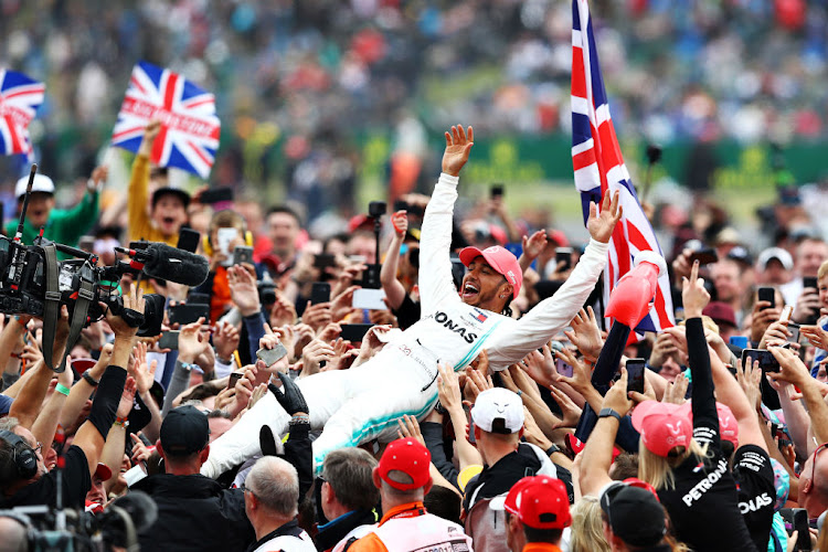 Race winner Lewis Hamilton of Great Britain and Mercedes GP celebrates winning the F1 Grand Prix of Great Britain at Silverstone last year. This year's British GP at the track is scheduled for July 19.