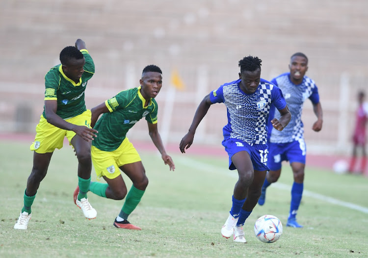 Bafedile Baloyi of Magesi and Tshepho Mashiloane of Baroka battle for the ball on Sunday.