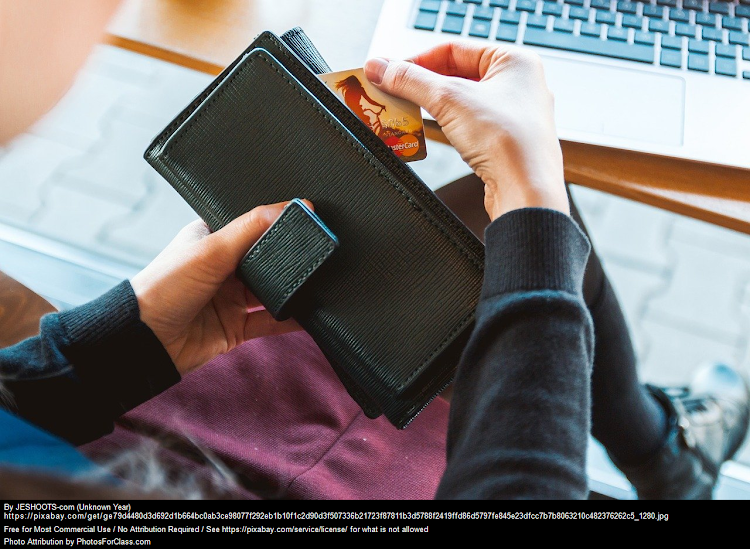 Woman taking out a credit card