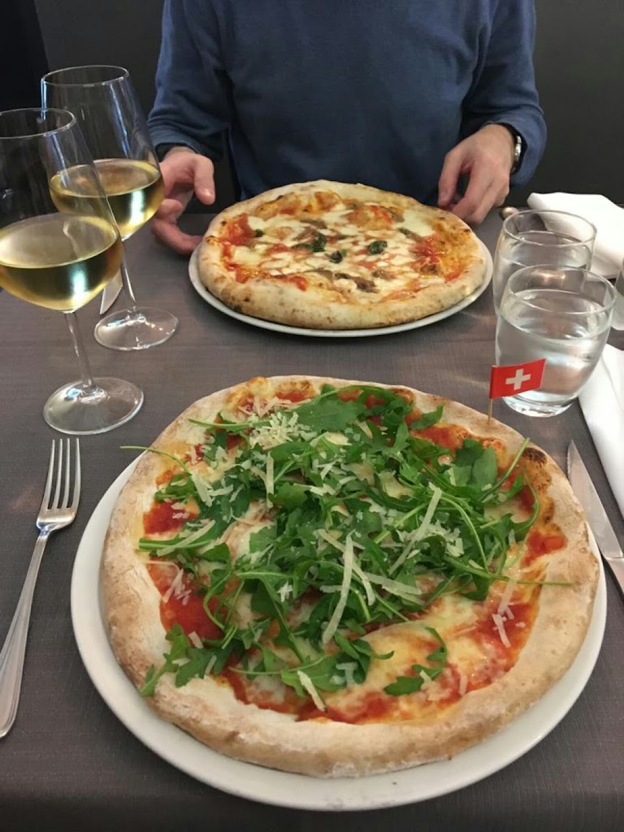 Absolutely perfect GF pizza. The GF is in the front and the one in the back is regular pizza. You cannot find a difference. And both perfect.