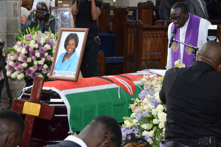 Reverend Canon Sammy Wainana prays for the body of the Bomet governor Joyce Laboso during memorial service at All Saints Cathedral.