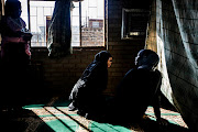 Women relax and chat in the Itirileng mosque in Pretoria after the midday prayer during the holy month of fasting, Ramadan on June 11, 2017.  The masjid, built by a community based non-profit organisation called Neighbourly Needs runs many projects in the area including building low cost housing, education programs and sustainable development feeding schemes. 